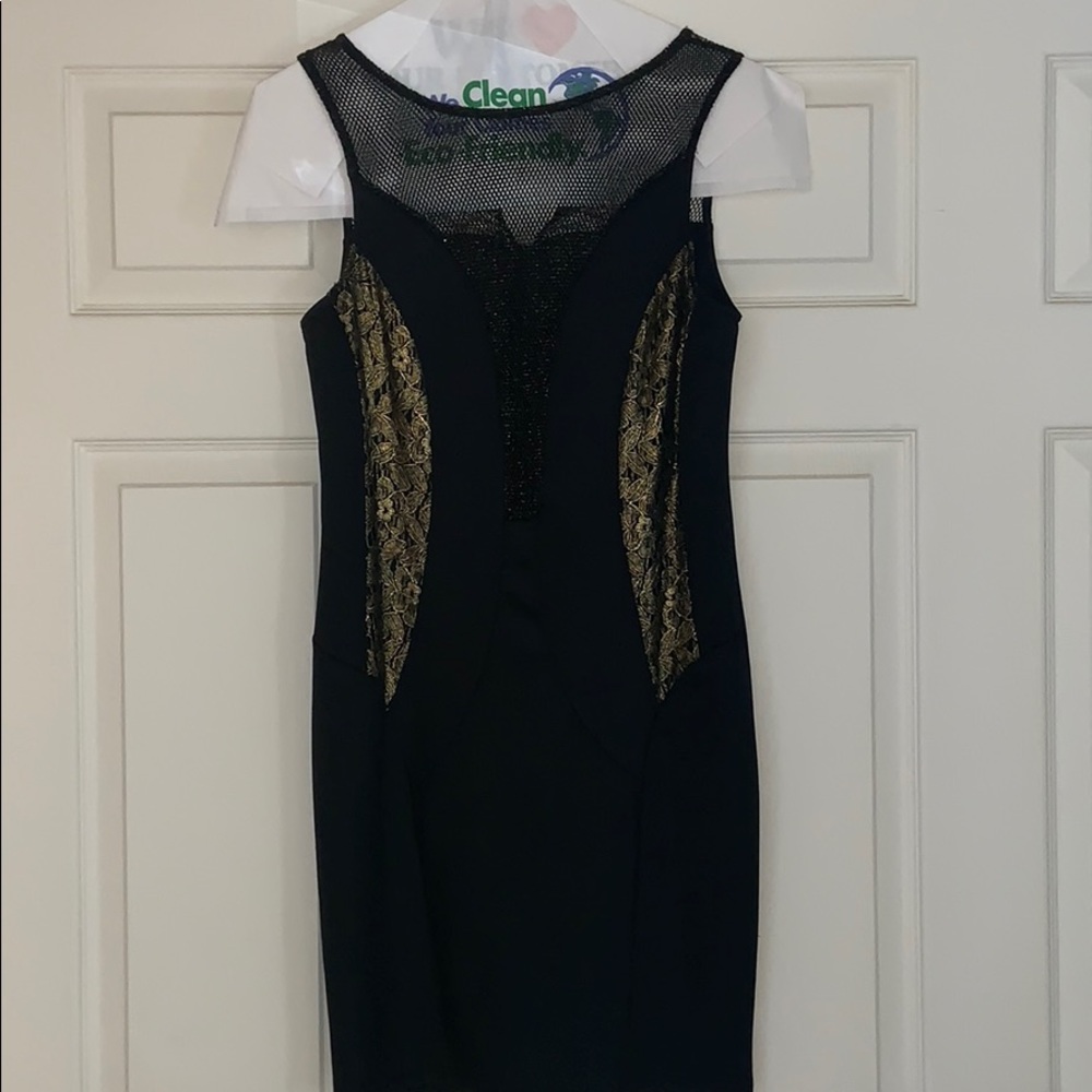 Never worn little black dress with gold accents